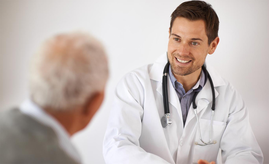 A young male doctor in a consultation with an elderly manhttp